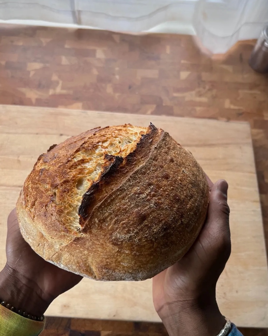 A crusty scored country sourdough loaf